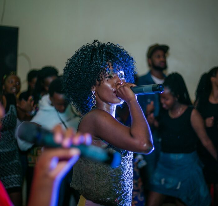 woman singing near people